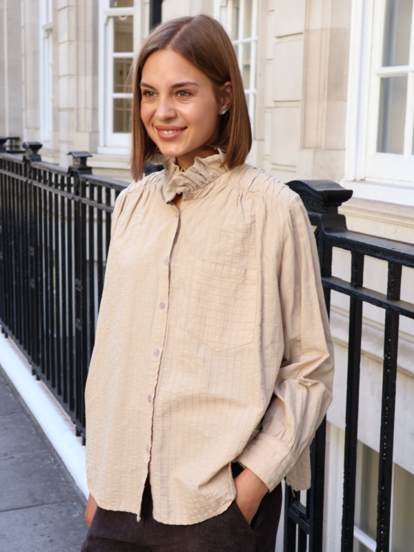 Charlie - High Neck Cotton Blouse with Frill Detail in Beige